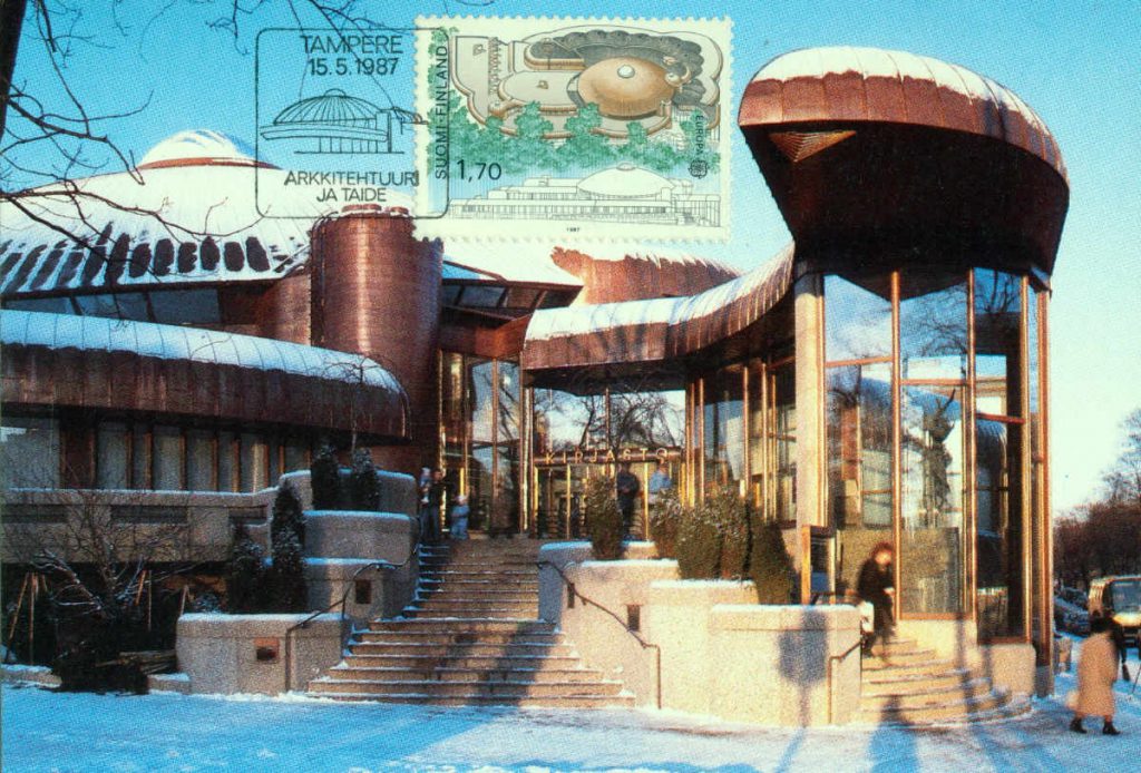 Tampereen Metso-kirjasto postikortissa, postimerkissä ja erikoisleimassa vuonna 1987.