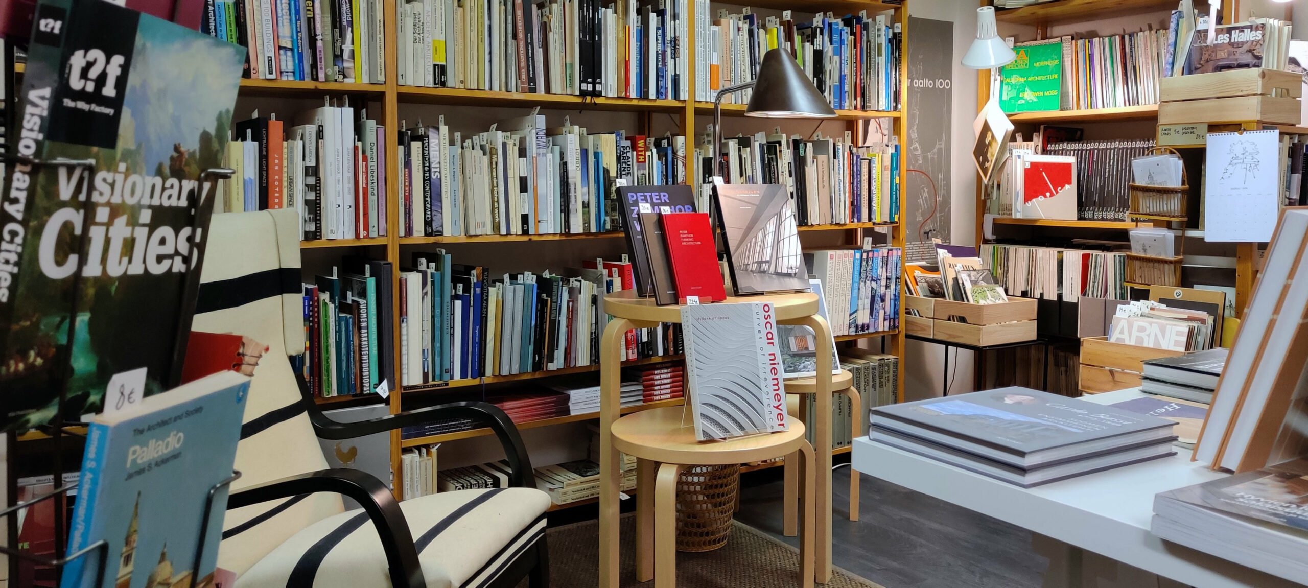 Bookshop interior showing bookshelves and a reading chair.
