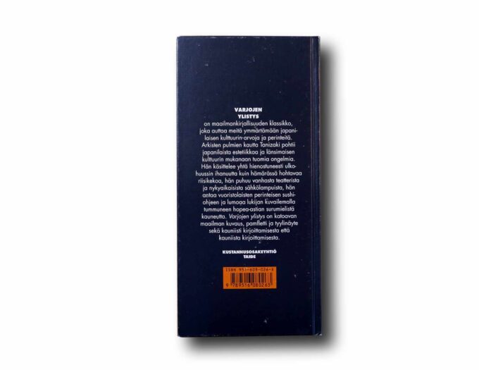 Photo showing a sample spread of the book Varjojen ylistys